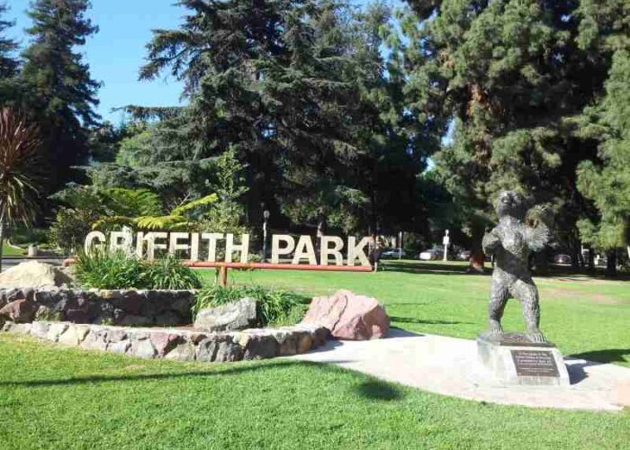 sign of Griffith Park, trees and scrubs