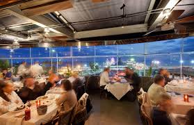 People sitting at table with white table cloth's