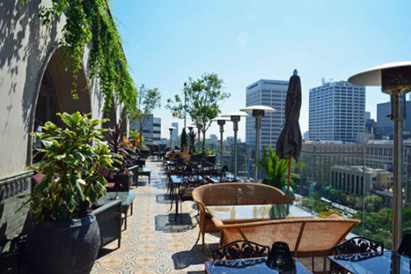 Rooftop tables and chairs with city view