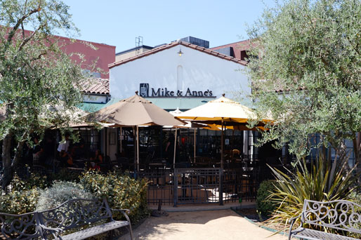 Restaurant with indoor/ Outdoor seating with umbrellas.