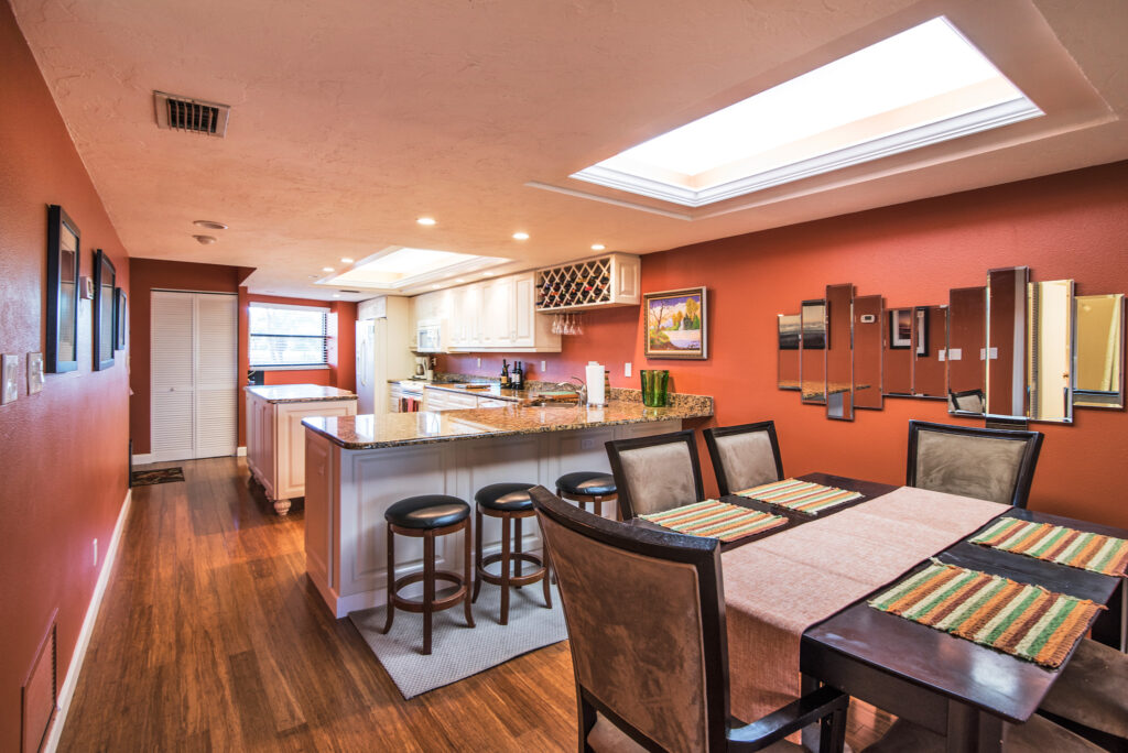 Siesta Key vacation property interior kitchen and dining room view.