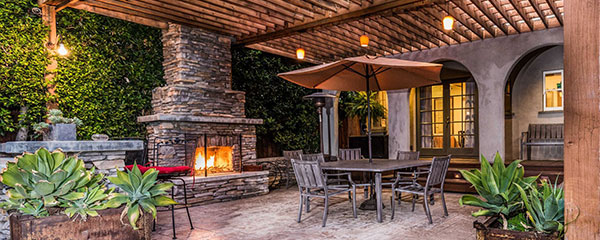 Altez Vacations Luxury Vacation Rental Property featuring Outdoor kitchen, patio, and large fireplace in Pasadena, California