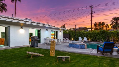 mid-century modern home with colorful sunset in Palm Springs